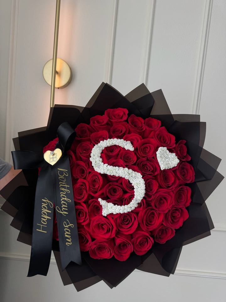 50 Red Roses Bouquet with Baby’s Breath Initial & Custom Banner – Black Wrapping