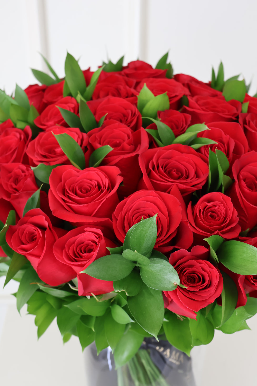 50 Red Roses Bouquet with Ruscus & Glass Vase Included